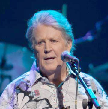 Brian Wilson onstage with blue lighting